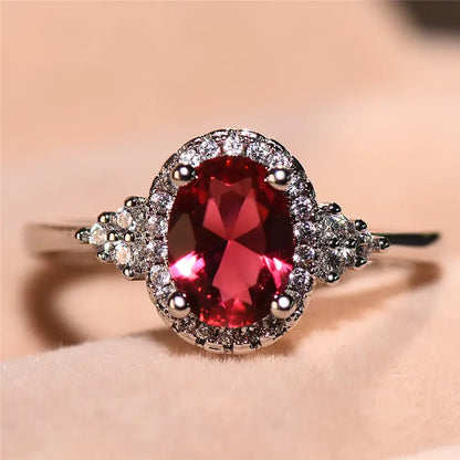 Anillo Halo Plateado con Rubí