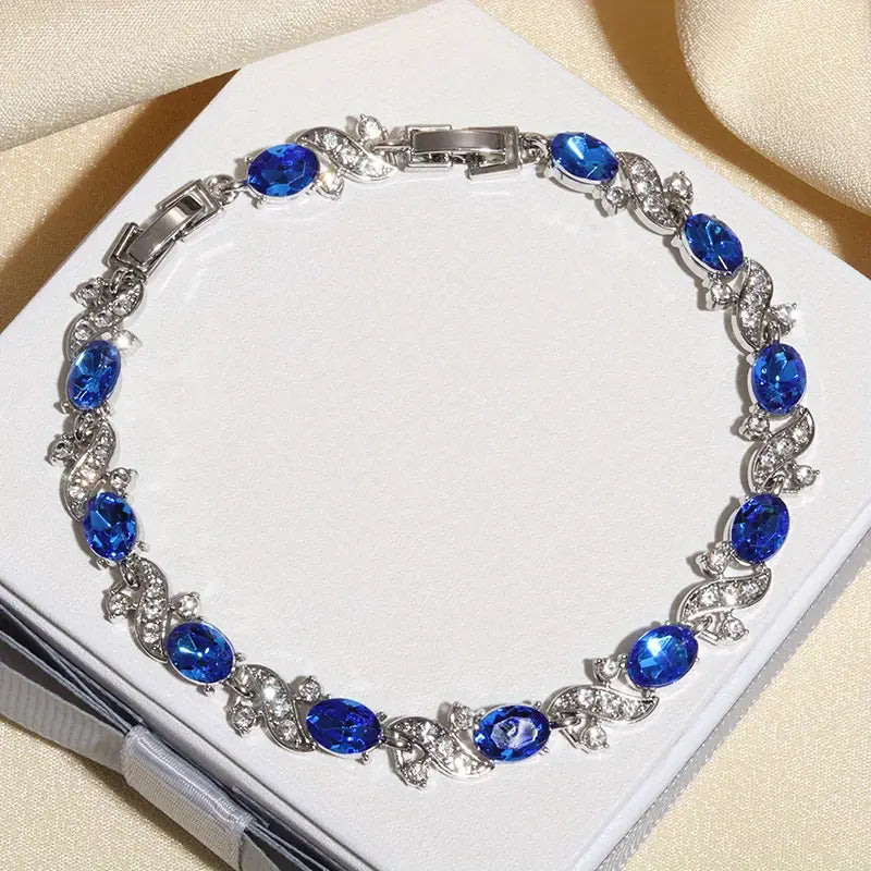Pulsera Plateada de Eslabones Florales con Zafiro